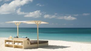 The Ritz-Carlton, Grand Cayman beach and lounge chairs at one of the best luxury Grand Cayman Resorts